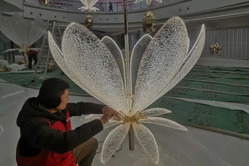 Ixmore Art craftsman working on a large illuminated art installation