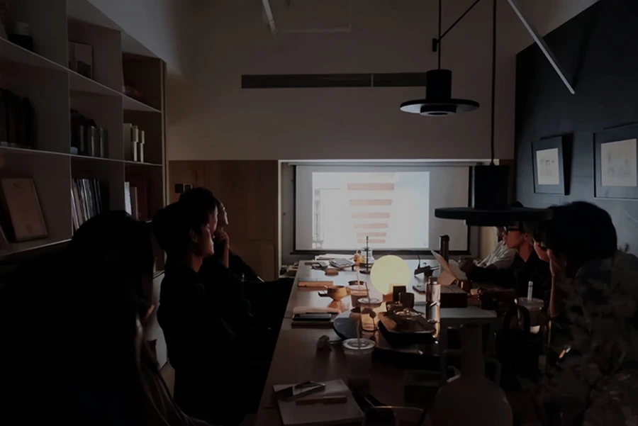 Ixmore Art multidisciplinary team collaborating on a project in a meeting room