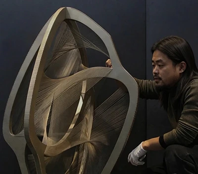 Jason Wang, Technical Director of Ixmore Art working on a large sculpture