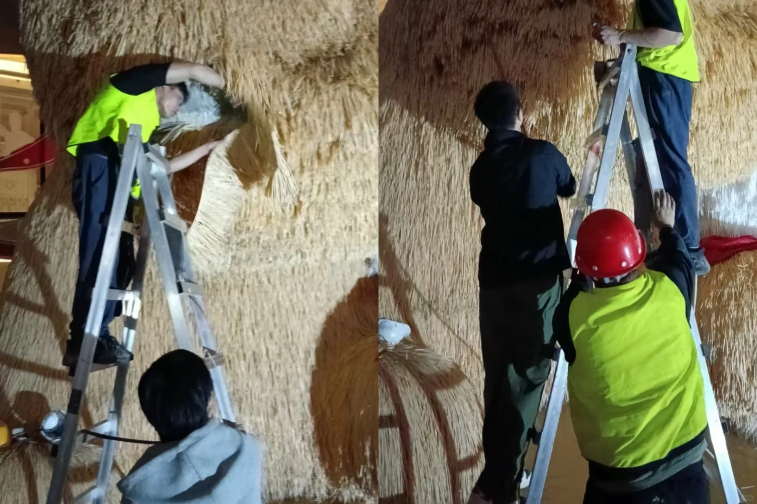 Nighttime construction scene of the outdoor giant cat art installation, with workers using ladders to perform detailed repairs and surface covering on the red and white plush body.