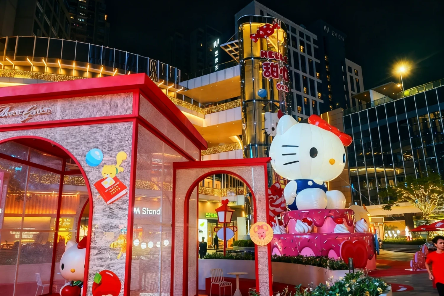 Hello Kitty dream theme exhibition custom installation overview at shopping mall, featuring immersive pink fantasy world with giant character sculptures and interactive displays, custom fabricated by professional art decoration factory-09