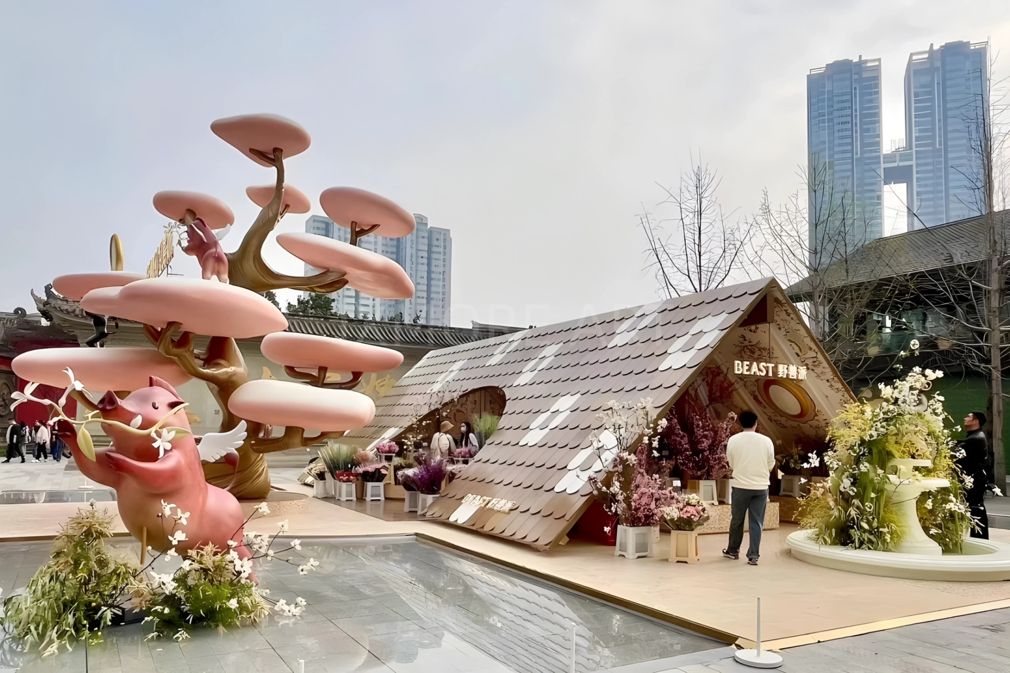 Long shot floral pop-up installation outside mall, event prop fabrication by original art factory, overall finished effect of large custom viral floral pop-up installation(4)