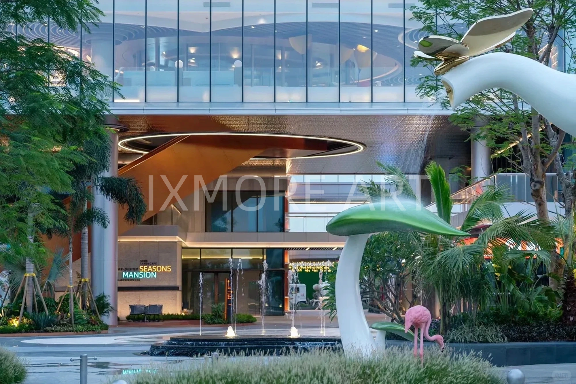 Long shot of Tropical Baby Elephant IP sculpture outside mall, mist spray dynamic device customized by professional art factory, overall finished effect of large outdoor public art installation(2)