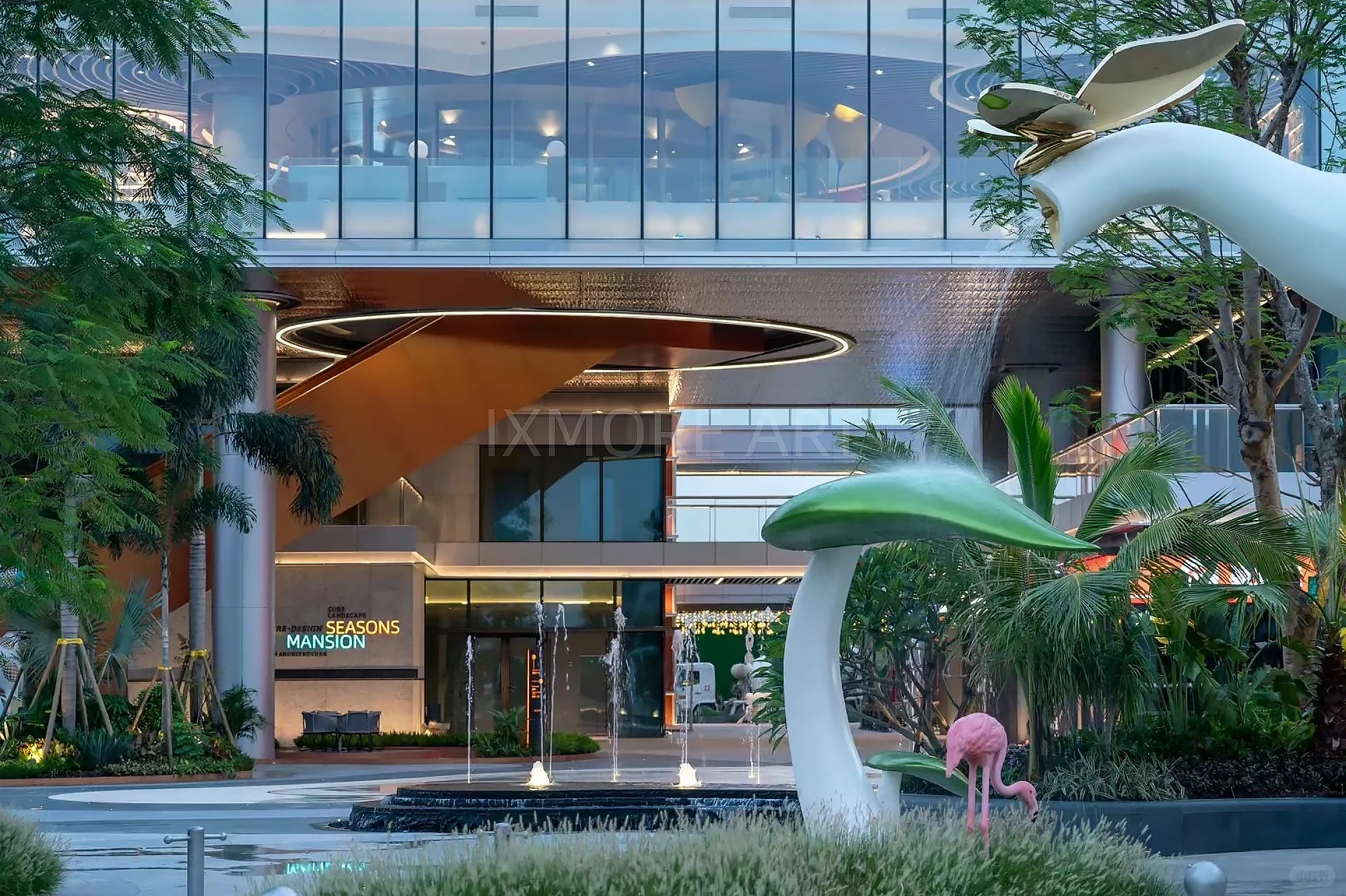 Long shot of Tropical Baby Elephant IP sculpture outside mall, mist spray dynamic device customized by professional art factory, overall finished effect of large outdoor public art installation(2)