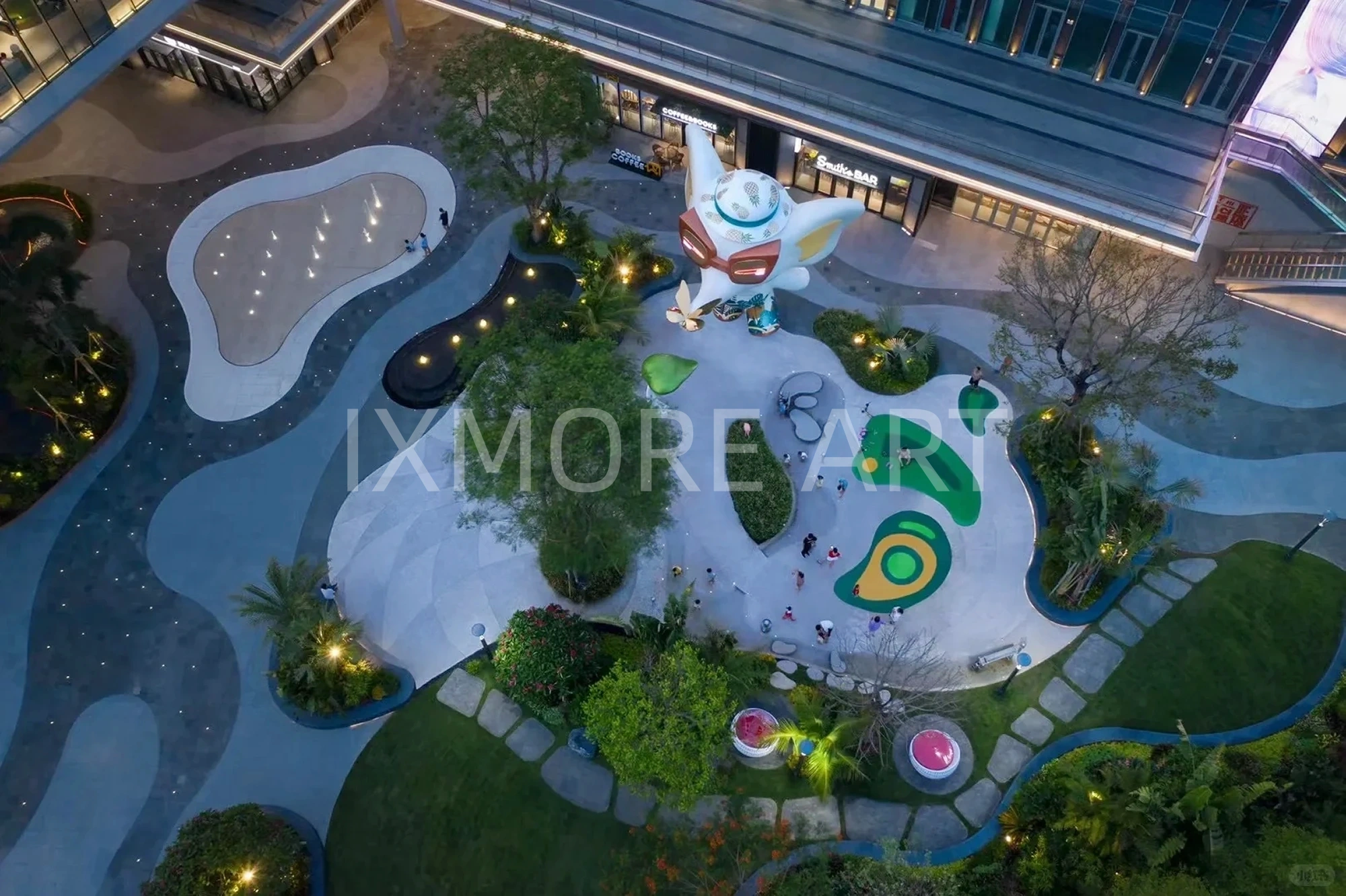 Long shot of Tropical Baby Elephant IP sculpture outside mall, mist spray dynamic device customized by professional art factory, overall finished effect of large outdoor public art installation(9)