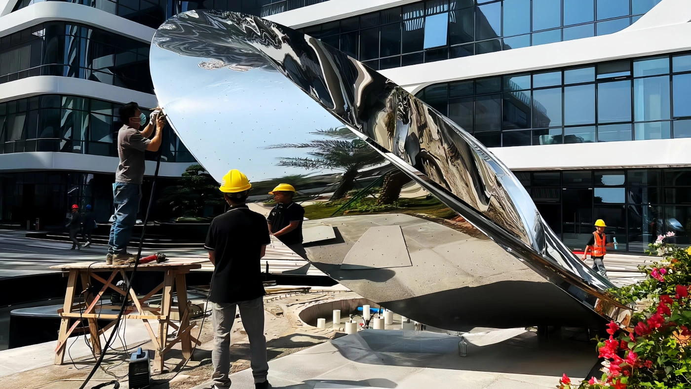 Large commercial installation being transported, hoisted, and anchored on site
